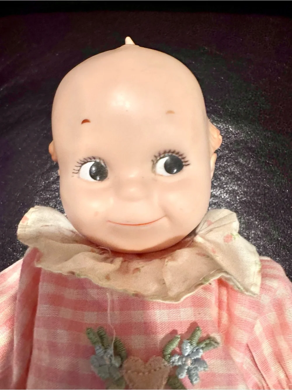 Vintage Kewpie Doll for Collectors, in pink ruffled outfit.